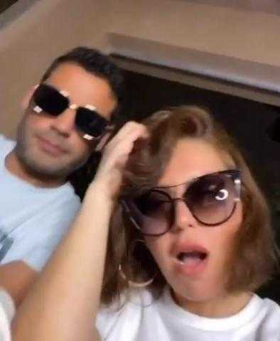 شاهد.. لقاء الخميسى وزوجها يرقصان على أغنية ”مليونير مليونير”