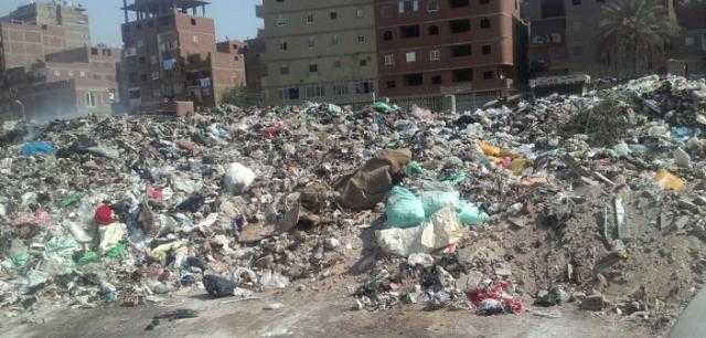 شكوى من تراكم القمامة بالبوابة الأولى بحدائق الأهرام بالجيزة