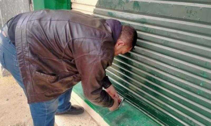 تحرير 208 مخالفة للمحلات التى لم تلتزم بقرار الغلق